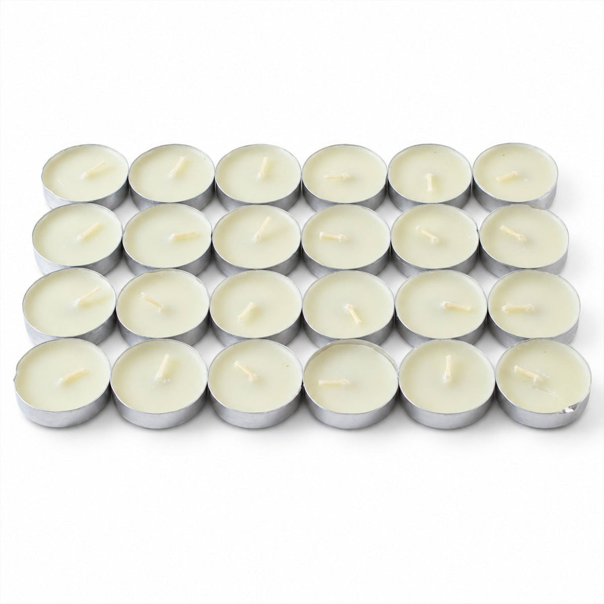 Twenty-four unlit white tealight candles with wicks, neatly arranged in a grid on a plain white surface.