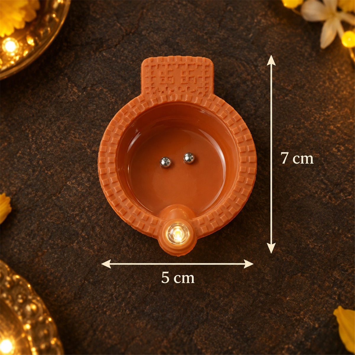 Diagram showing approximate 7 cm length and 5 cm width of a water sensor diya
