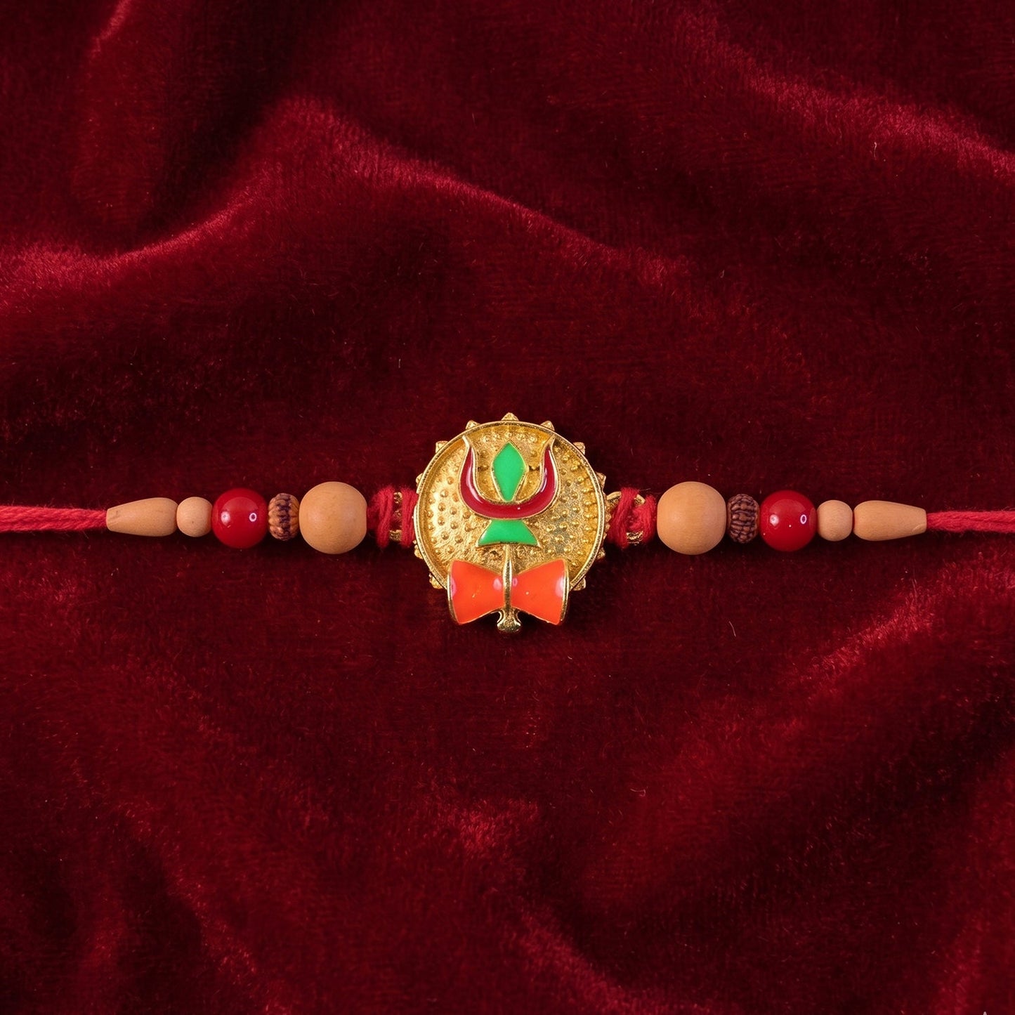 Elegant Trishul Damru centerpiece on Rakhi with red thread