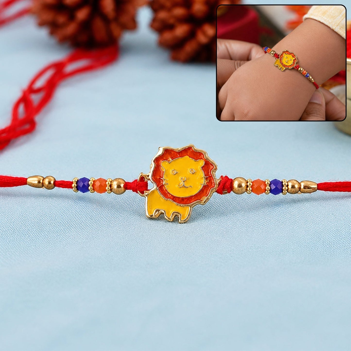 Kids Rakhi featuring a cute lion cartoon with colorful beaded thread on a white background.