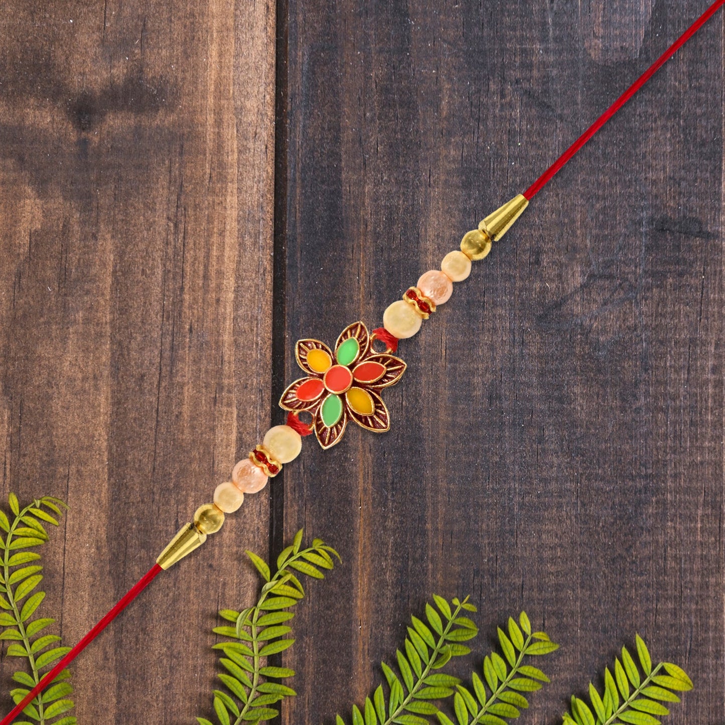 Detailed view of colourful beads and floral patterns on handcrafted Floral Bead Rakhi