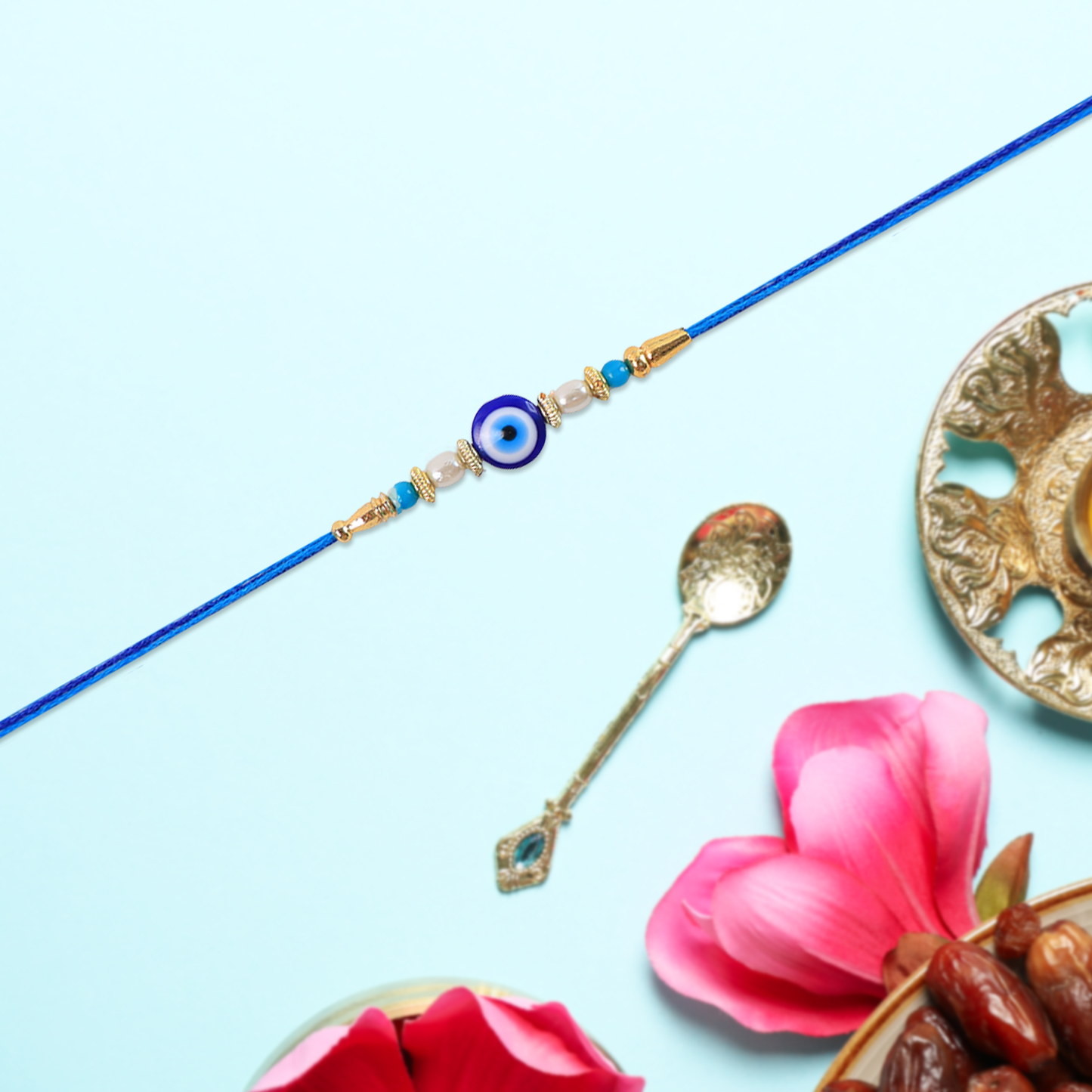 Front view of elegant Blue Rakhi showcasing shimmering pearl beads