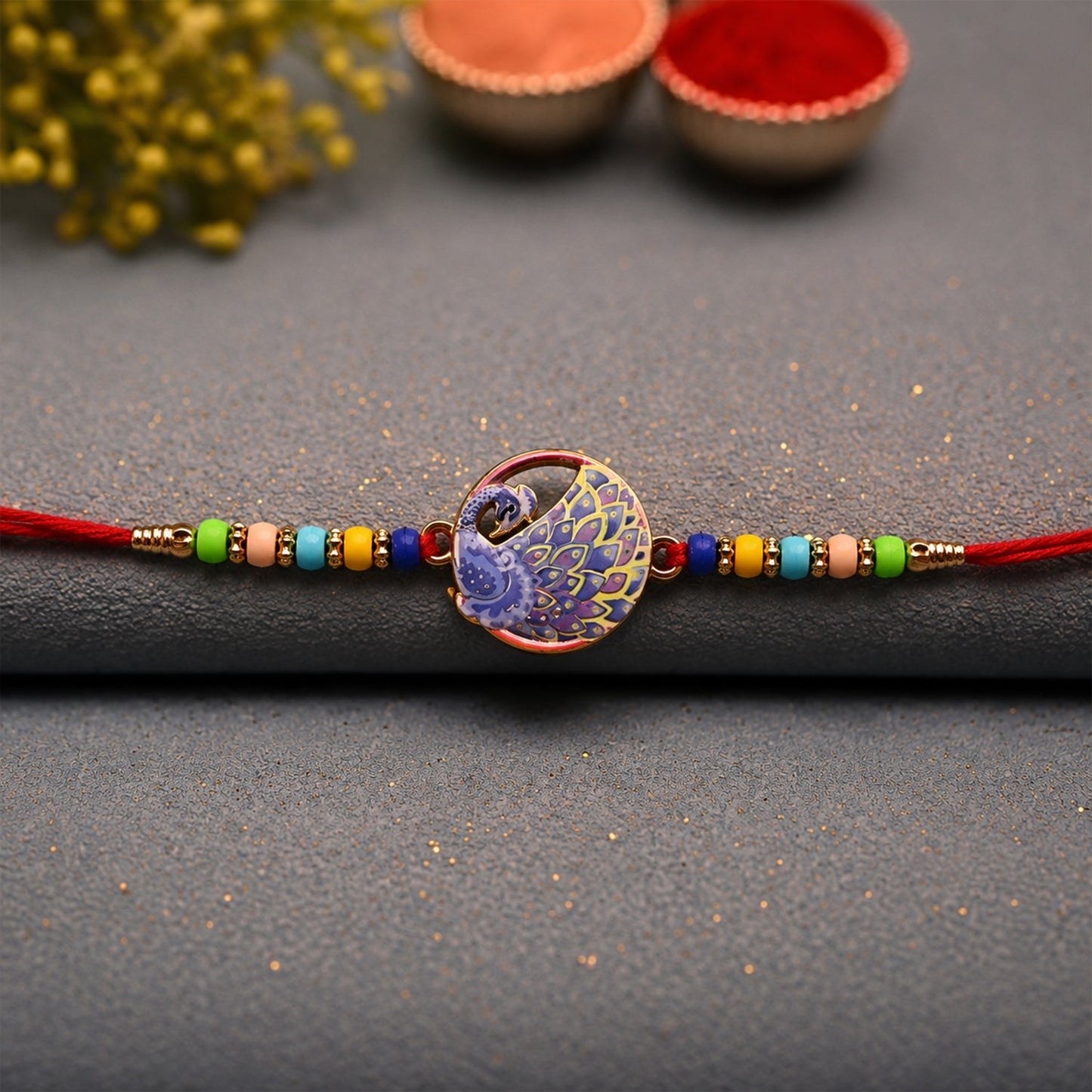 Elegant peacock design Rakhi with multicolor beads on a festive background