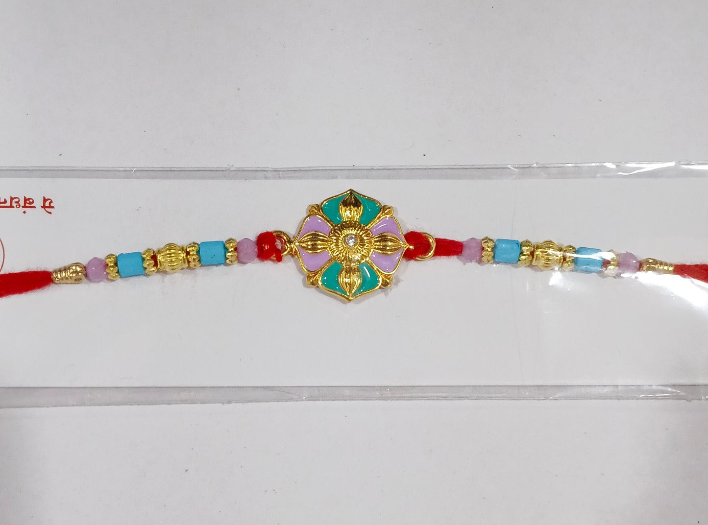 Stylish flower motif rakhi on festive background