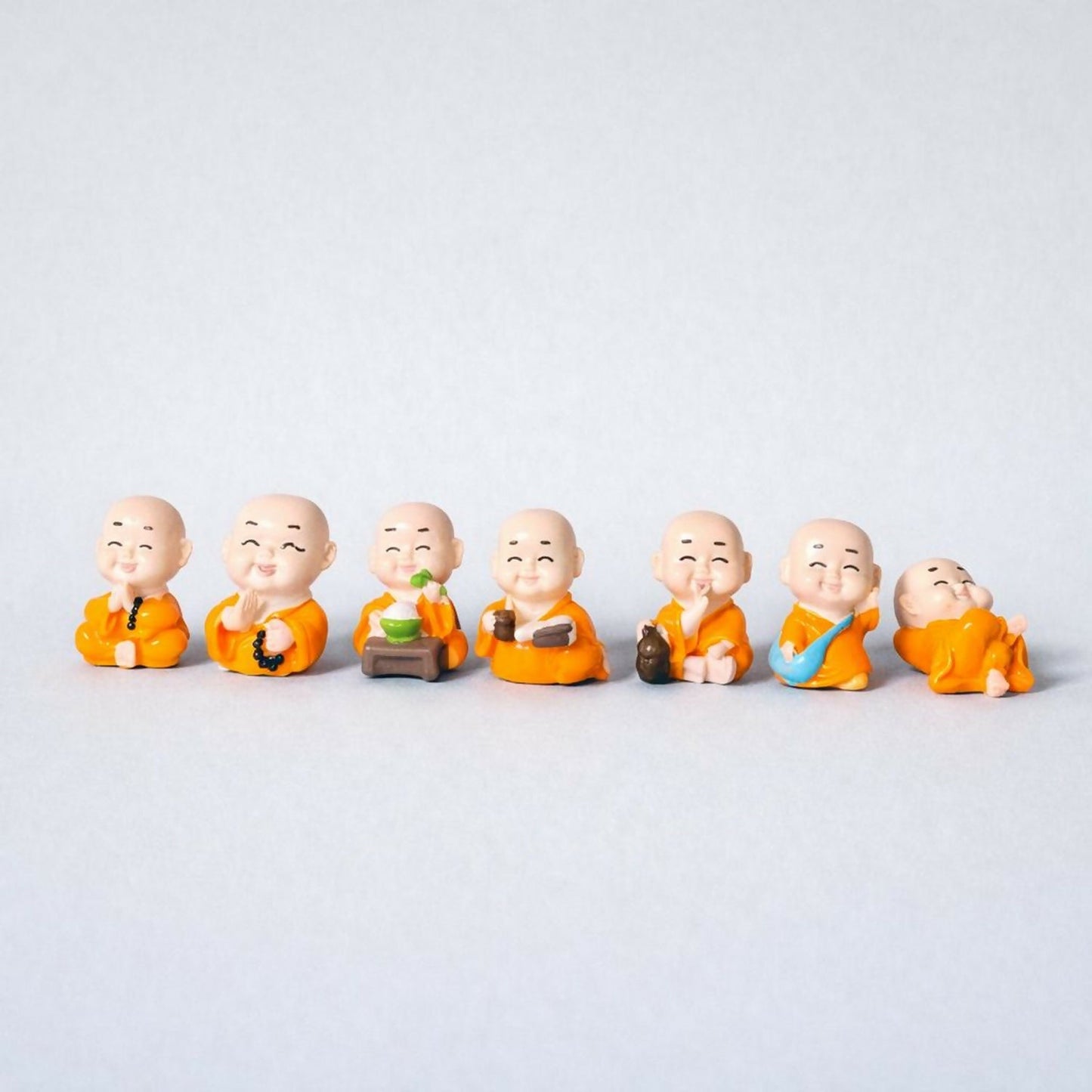 Smiling Monk Showpiece Set of 8 | Mini Buddha Figurines for Home Decor