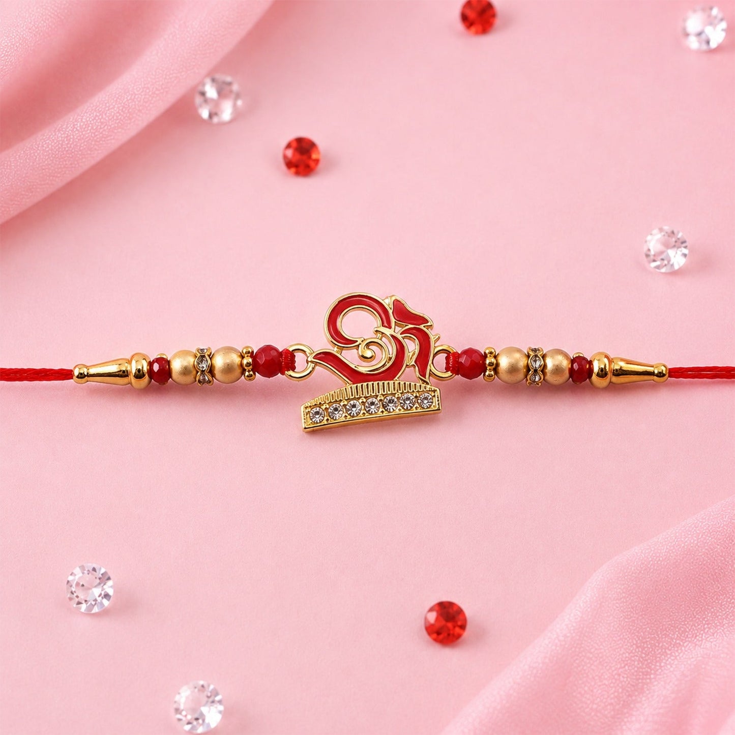 Traditional Rakhi featuring sacred OM design, handcrafted for Raksha Bandhan celebrations.