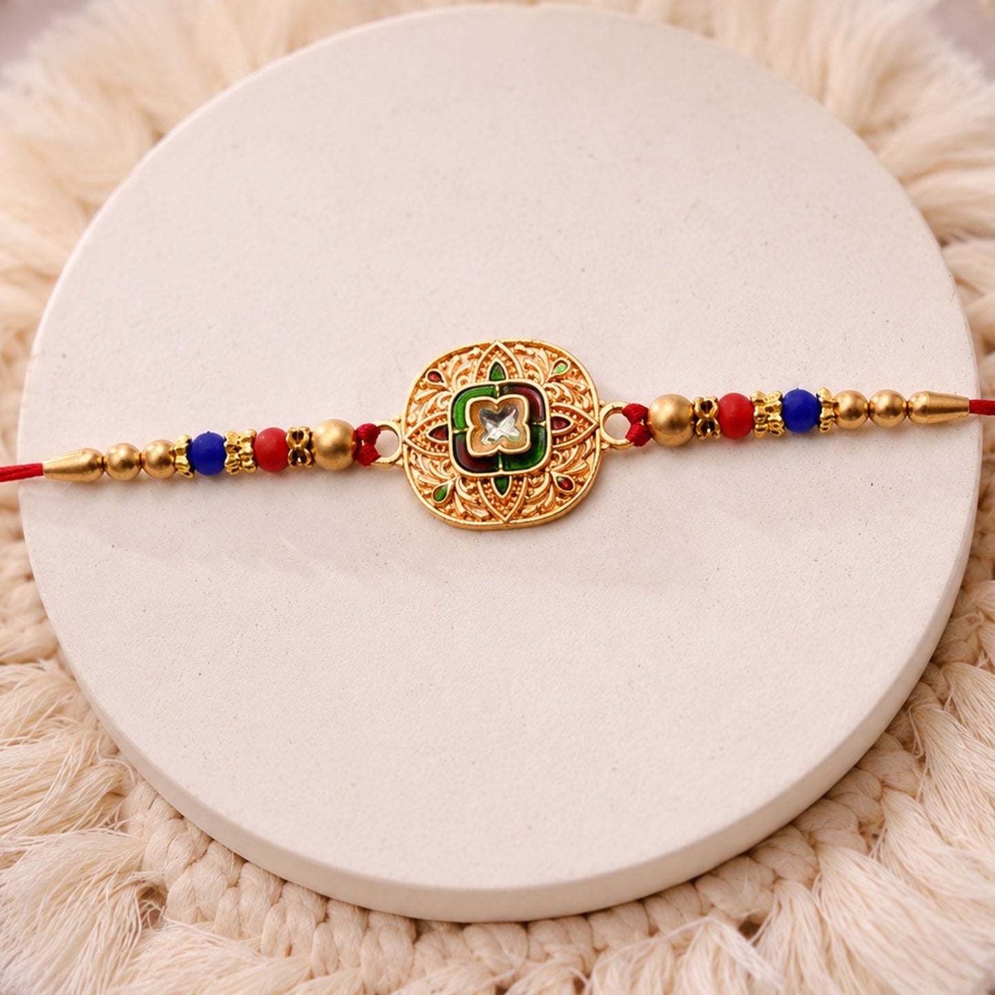 Kundan Rakhi with traditional antique gold finish and vibrant multicolor beads for Raksha Bandhan