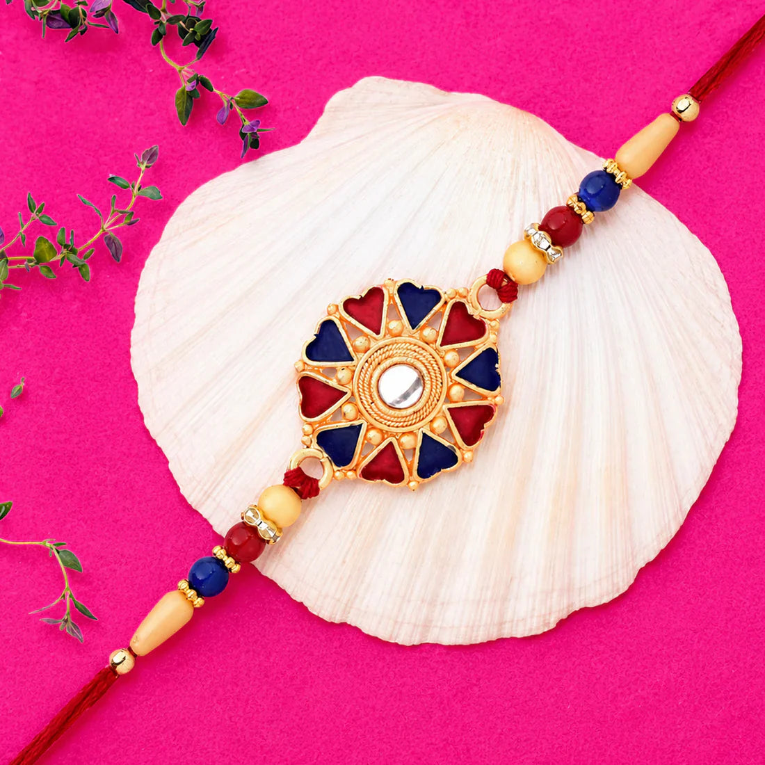 Festive floral rakhi with golden beads ready for tying on brother’s wrist