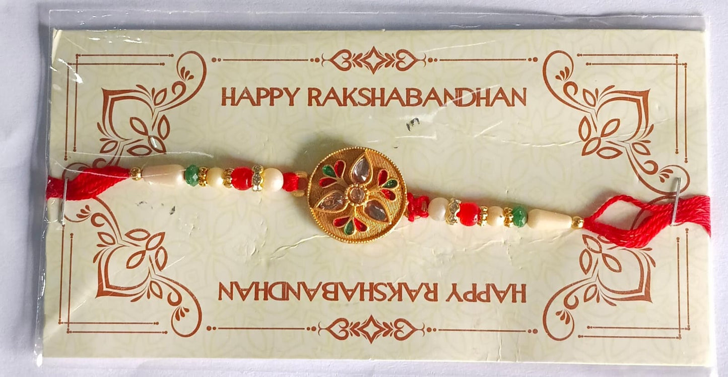 Detailed view of the sacred Kalash motif and golden embellishments on the Rakhi.