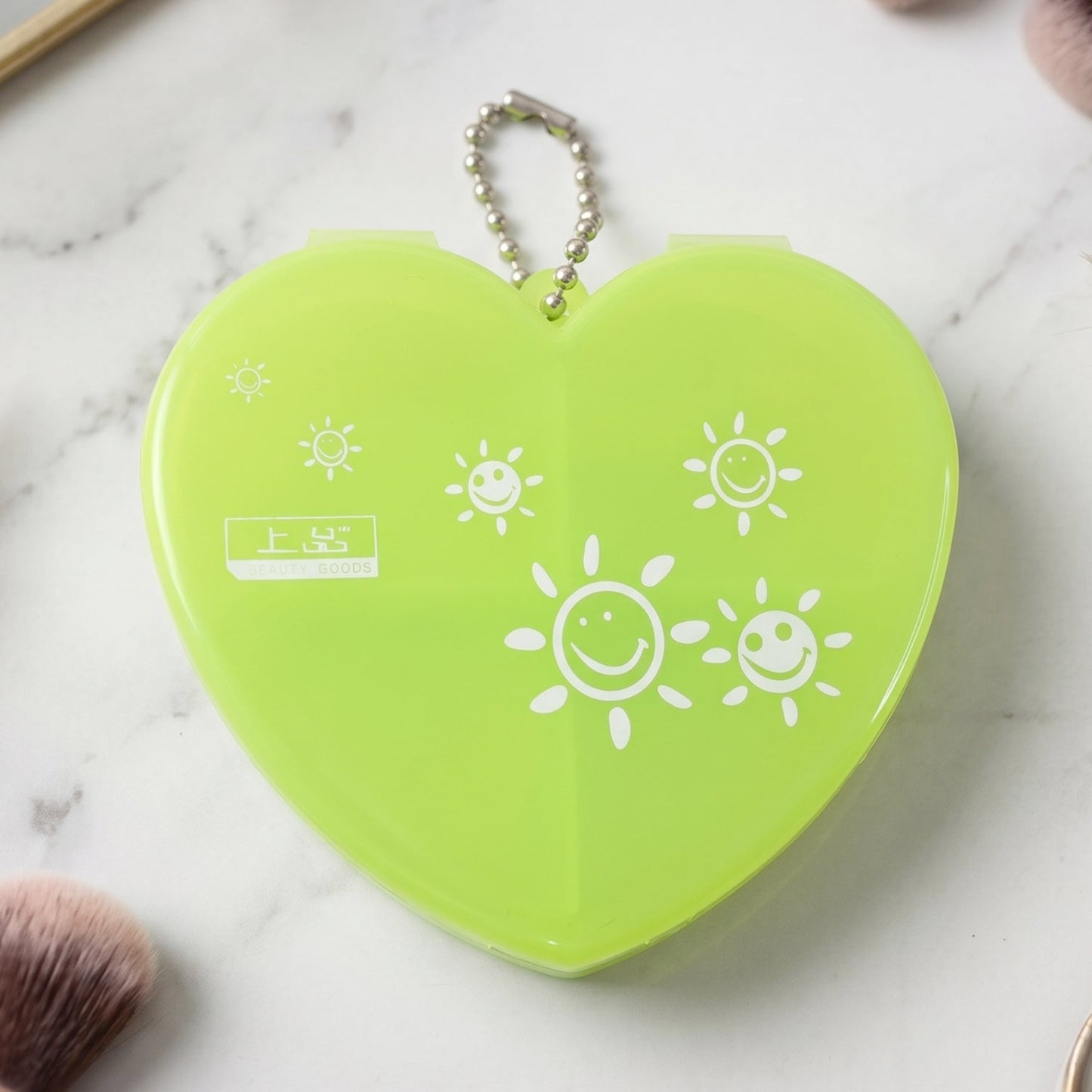 Pill organizer attached to a keychain