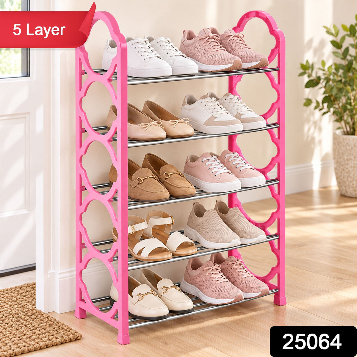 A pink five-layer shoe storage unit filled with an assortment of shoes, shown in a home entrance.