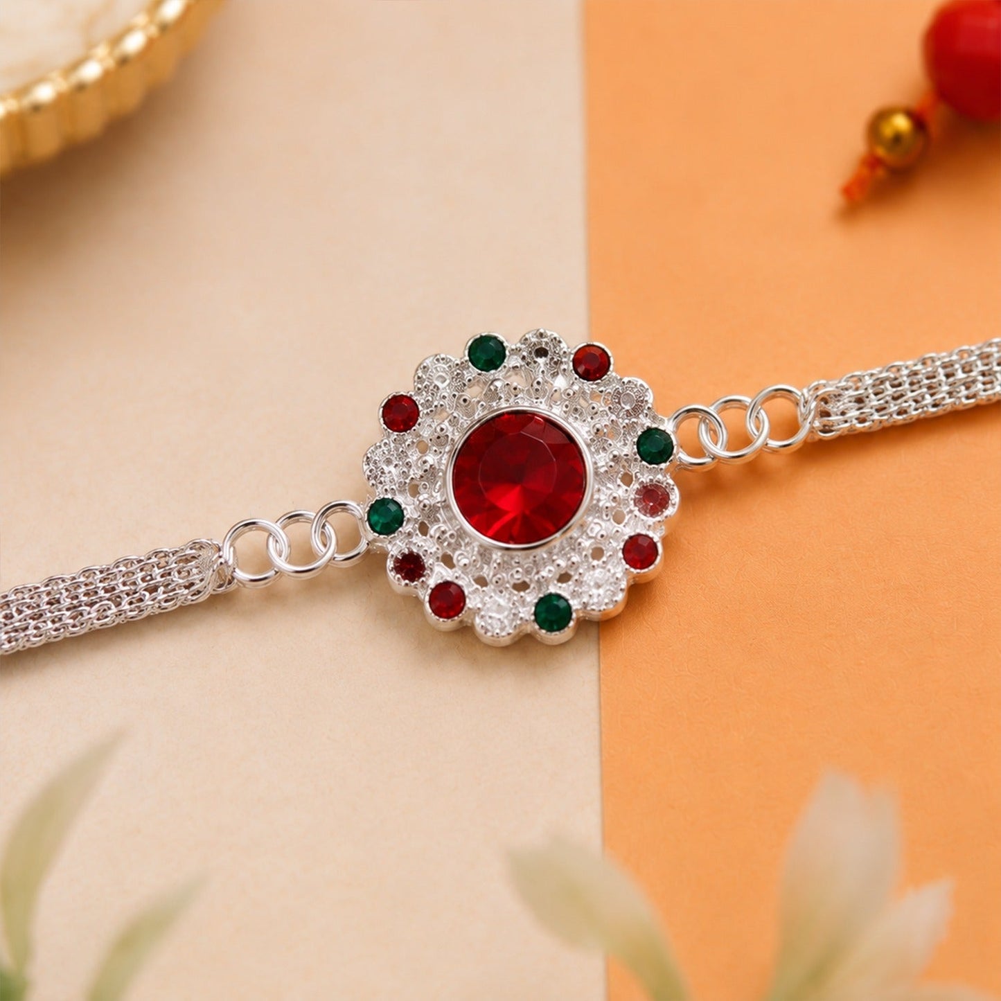 Elegant Silver Stone Chain Rakhi for Raksha Bandhan celebrations.