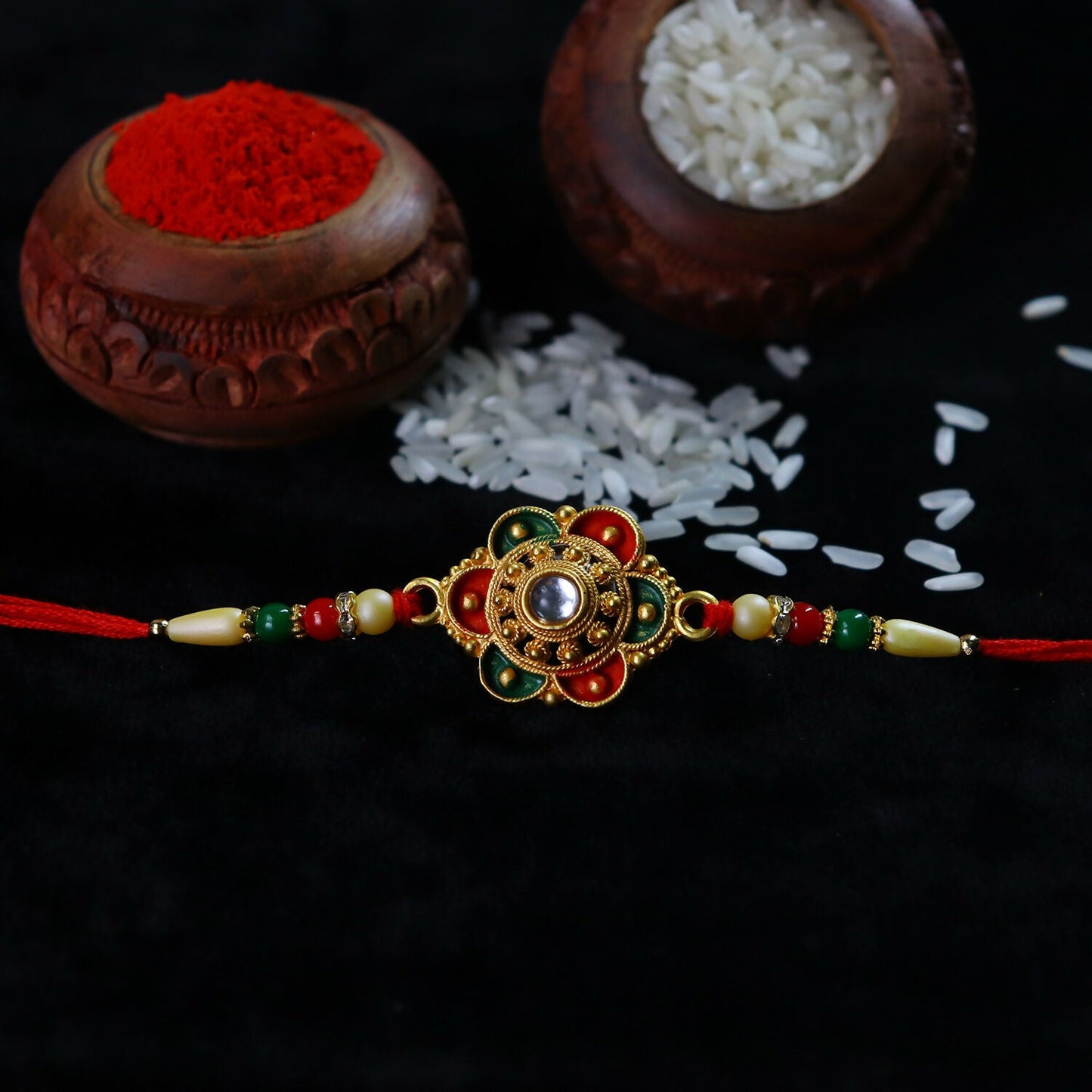 Side view of traditional Indian rakhi showing floral bead design