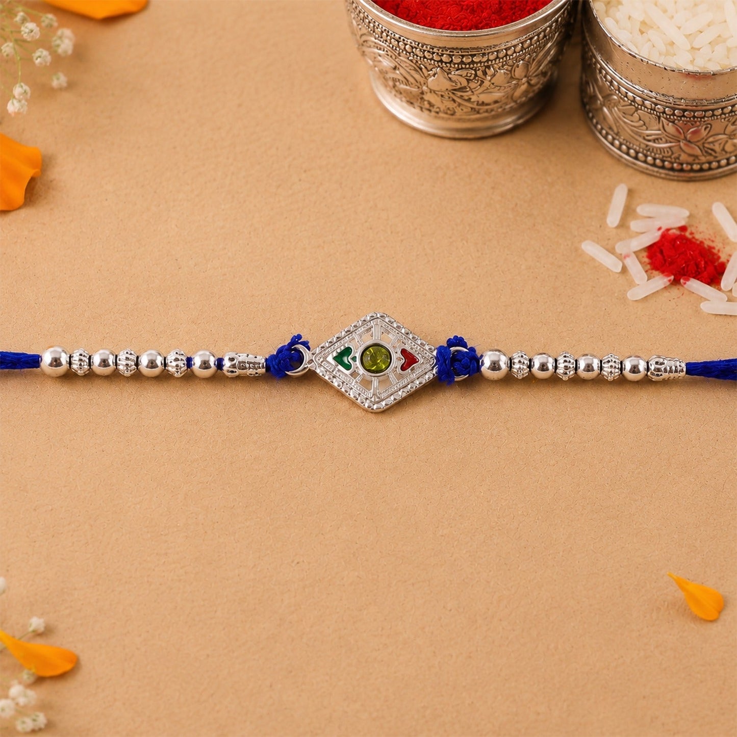 Silver Kite Rakhi with stone charm and beads, ready for Raksha Bandhan.