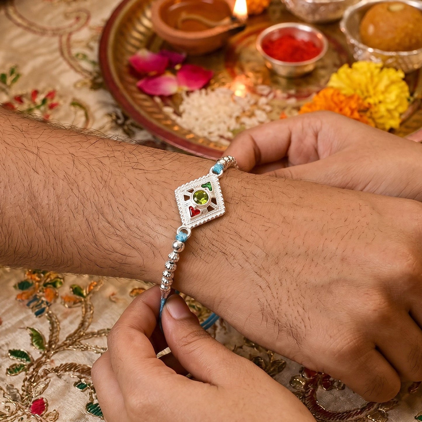 Silver Diamond Kundan Rakhi displayed on white background