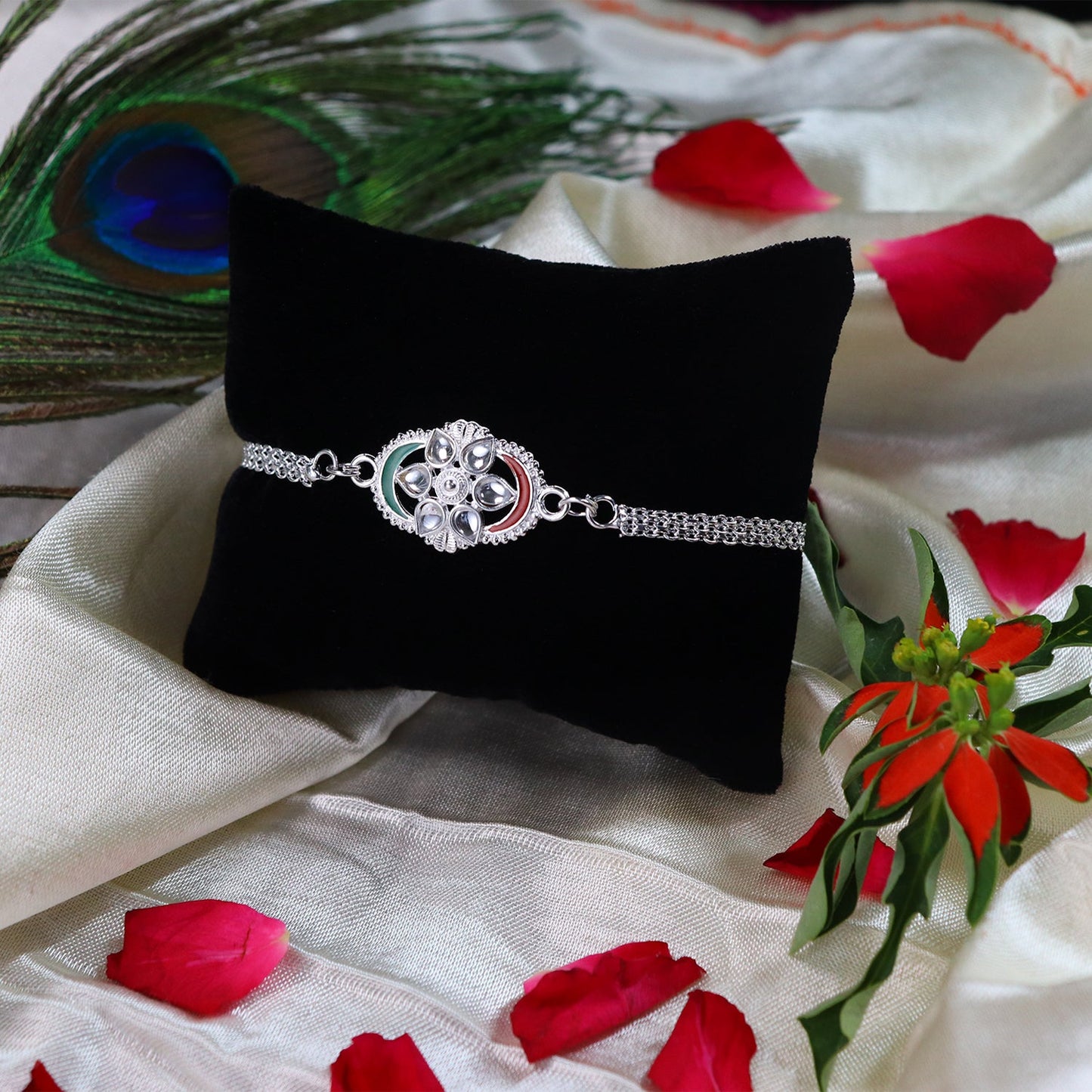 Close-up of stylish Silver Rakhi highlighting detailed modern chain link pattern and tricolor accents.