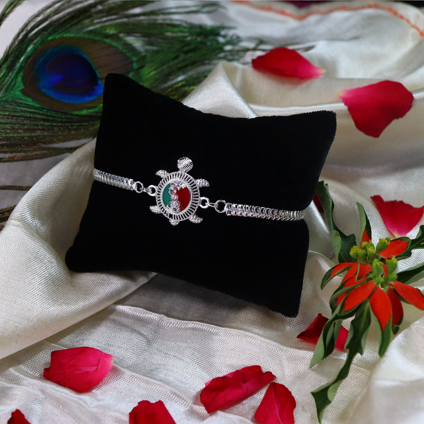Elegant Turtle Rakhi featuring detailed red and green enamel design for Raksha Bandhan.