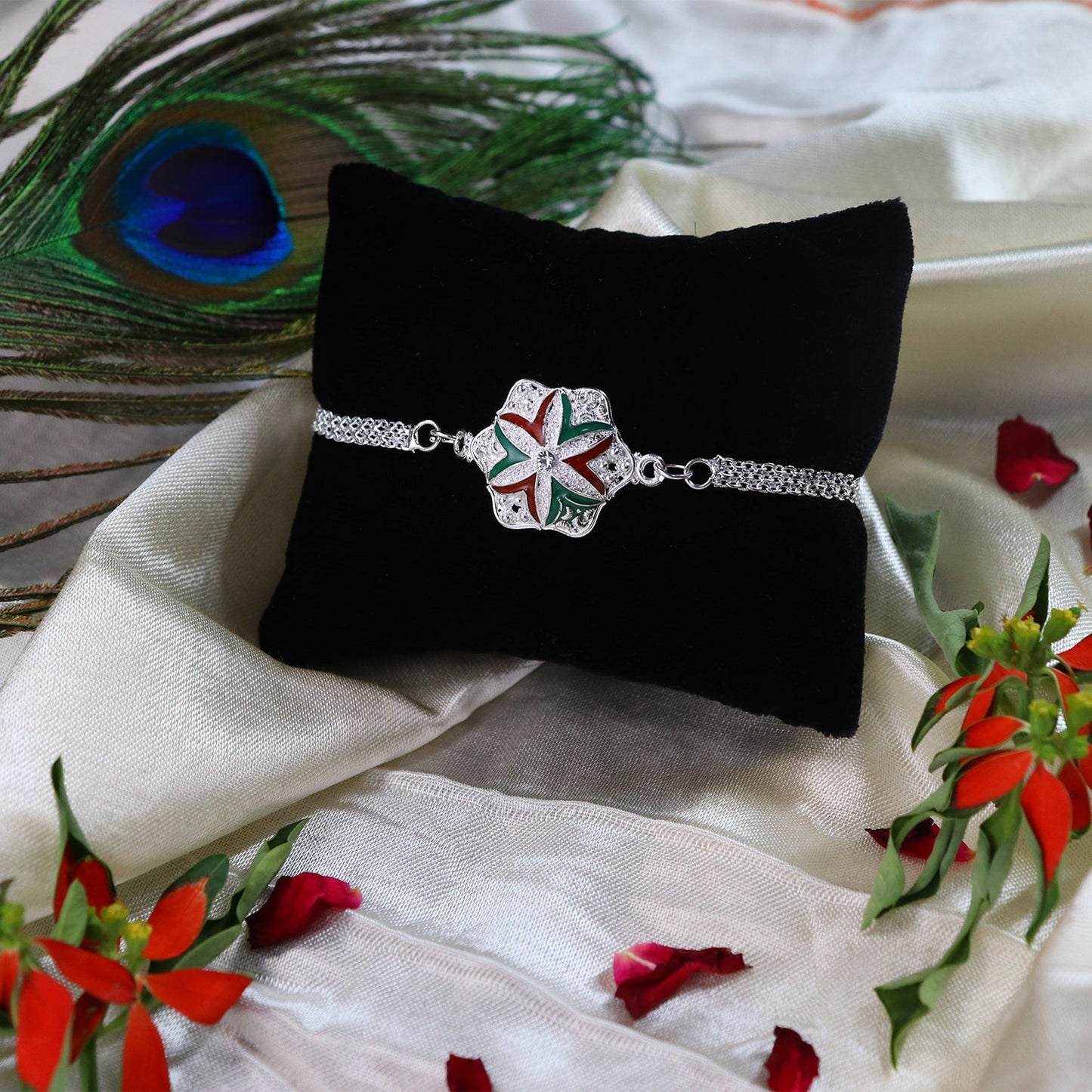 Close-up of delicate flower motif on Silver Chain Rakhi