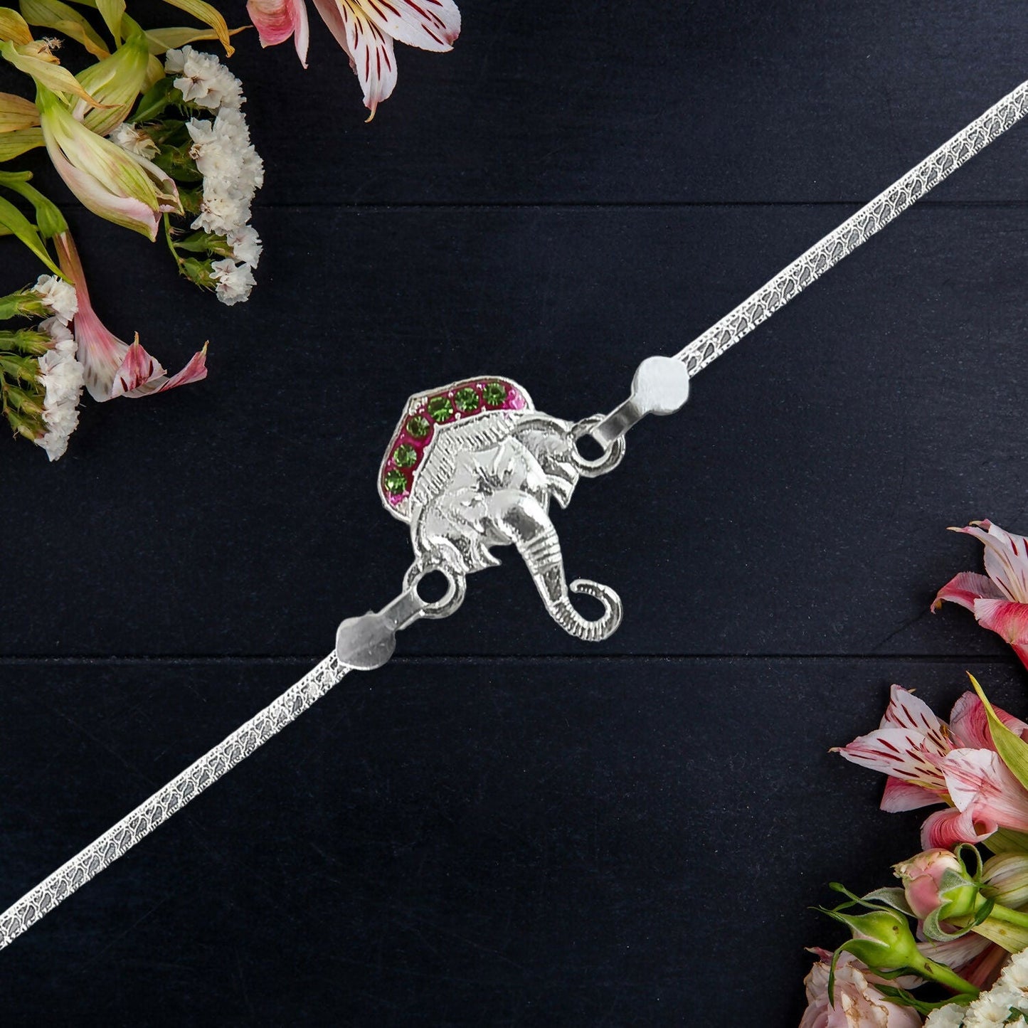 Beautiful mix design silver rakhi showcasing elegant traditional motifs