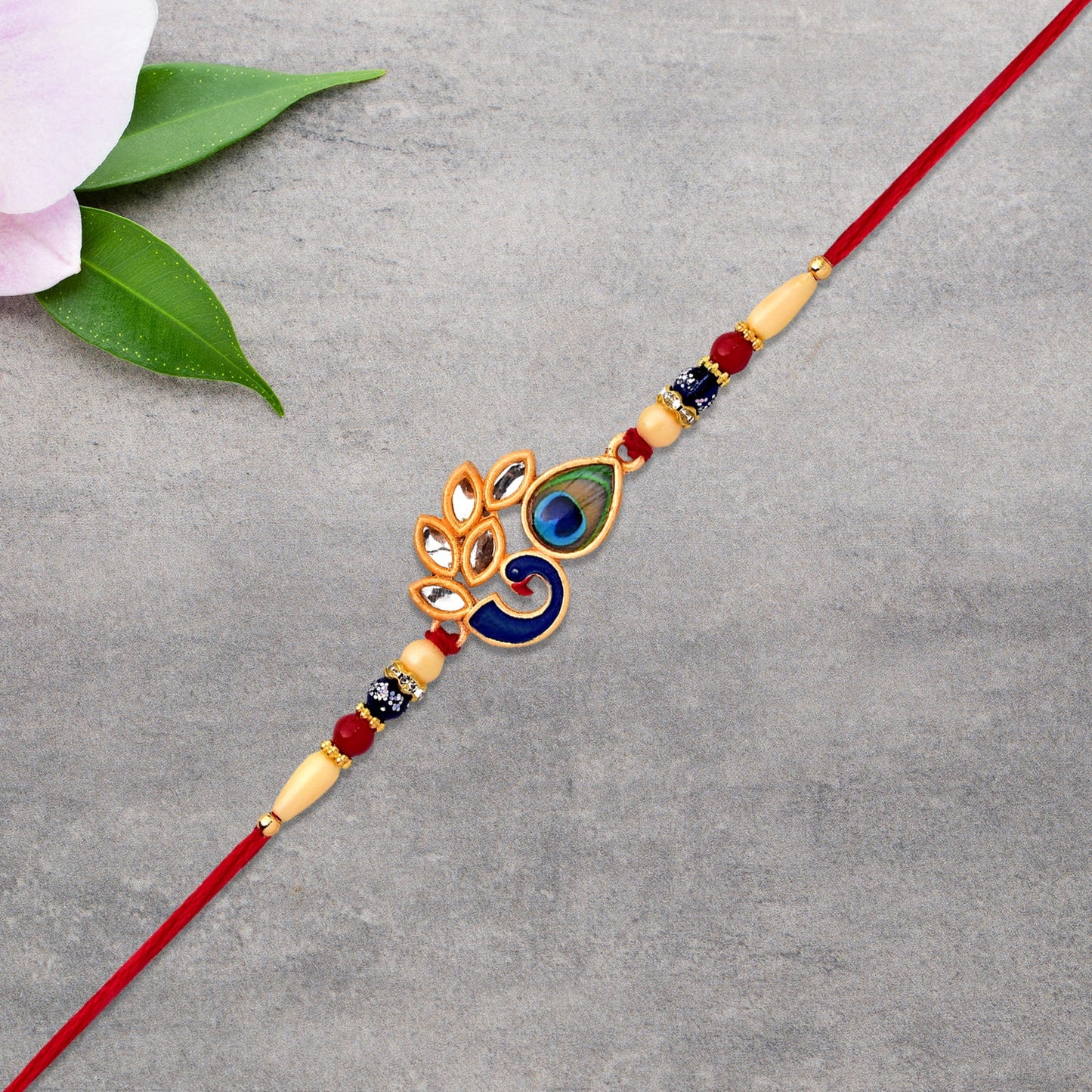 Side view of traditional Mor Pankh Rakhi design