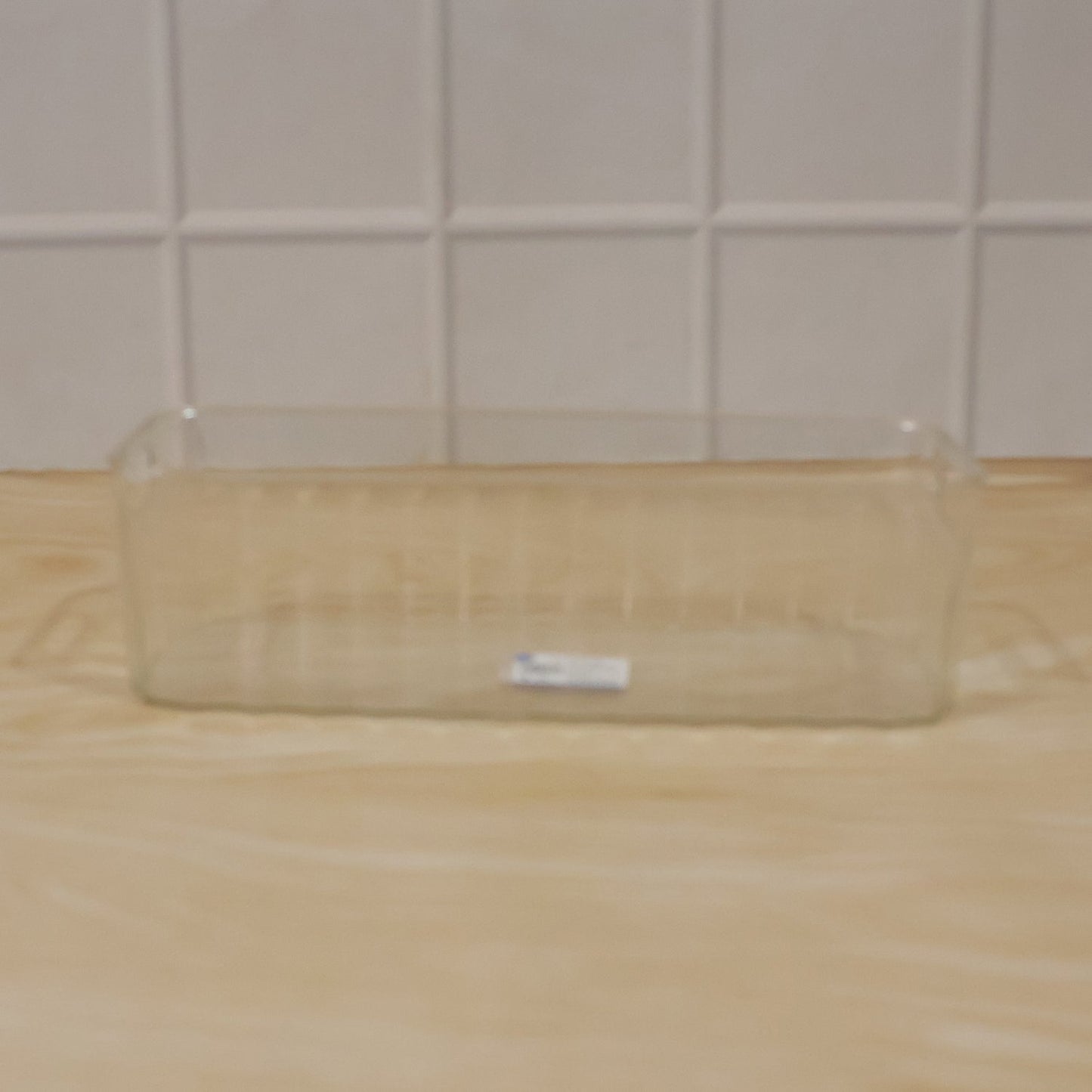 Easy-to-clean plastic basket for pantry and fridge organization.
