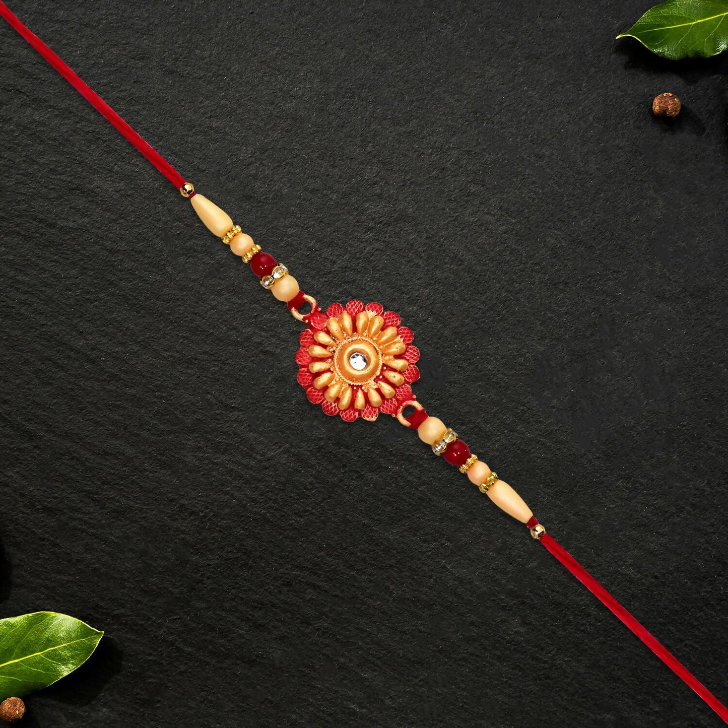 Decorative floral bead Rakhi displayed with traditional Raksha Bandhan decorations