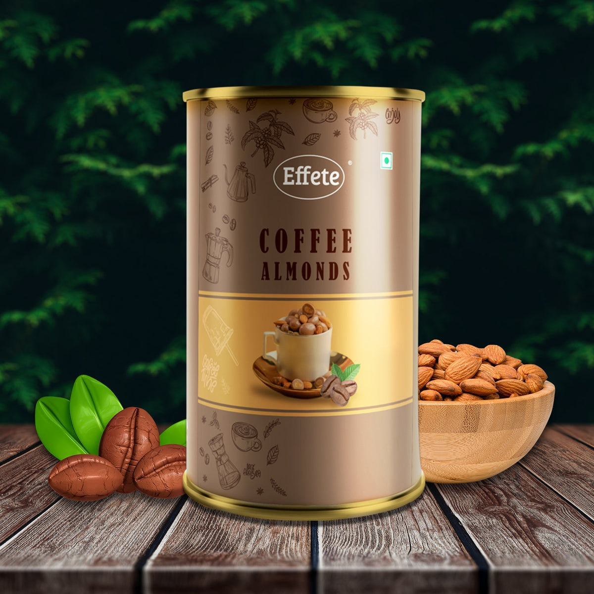 Brown and gold tin of coffee almonds with coffee beans, green leaves, and a wooden bowl of almonds on a dark wooden surface.