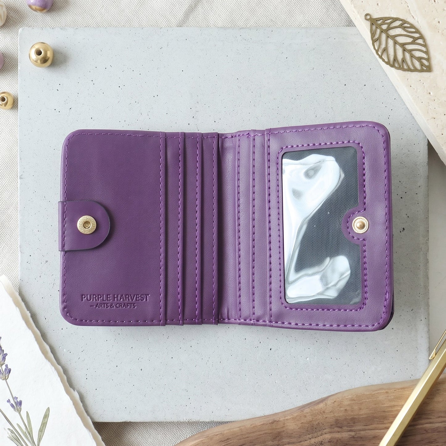 Slim bifold wallet held in hand