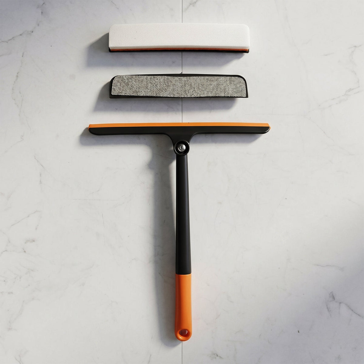 Versatile squeegee for cleaning car windshields, windows, and bathroom tiles