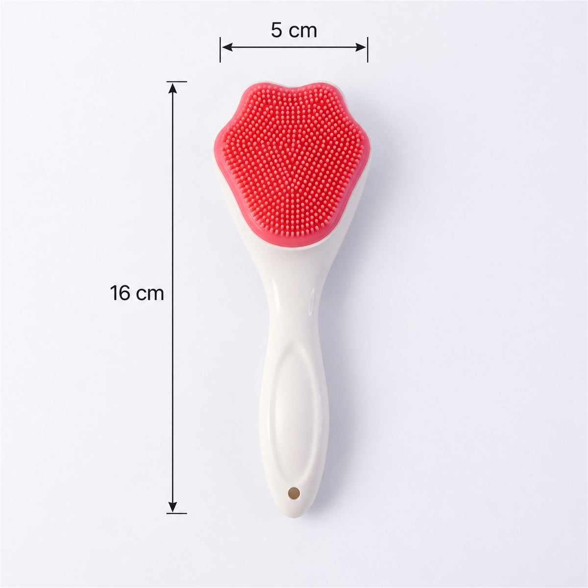A white-handled brush with a pink, paw-shaped silicone head is shown with dimensions of 16 cm length and 5 cm width.