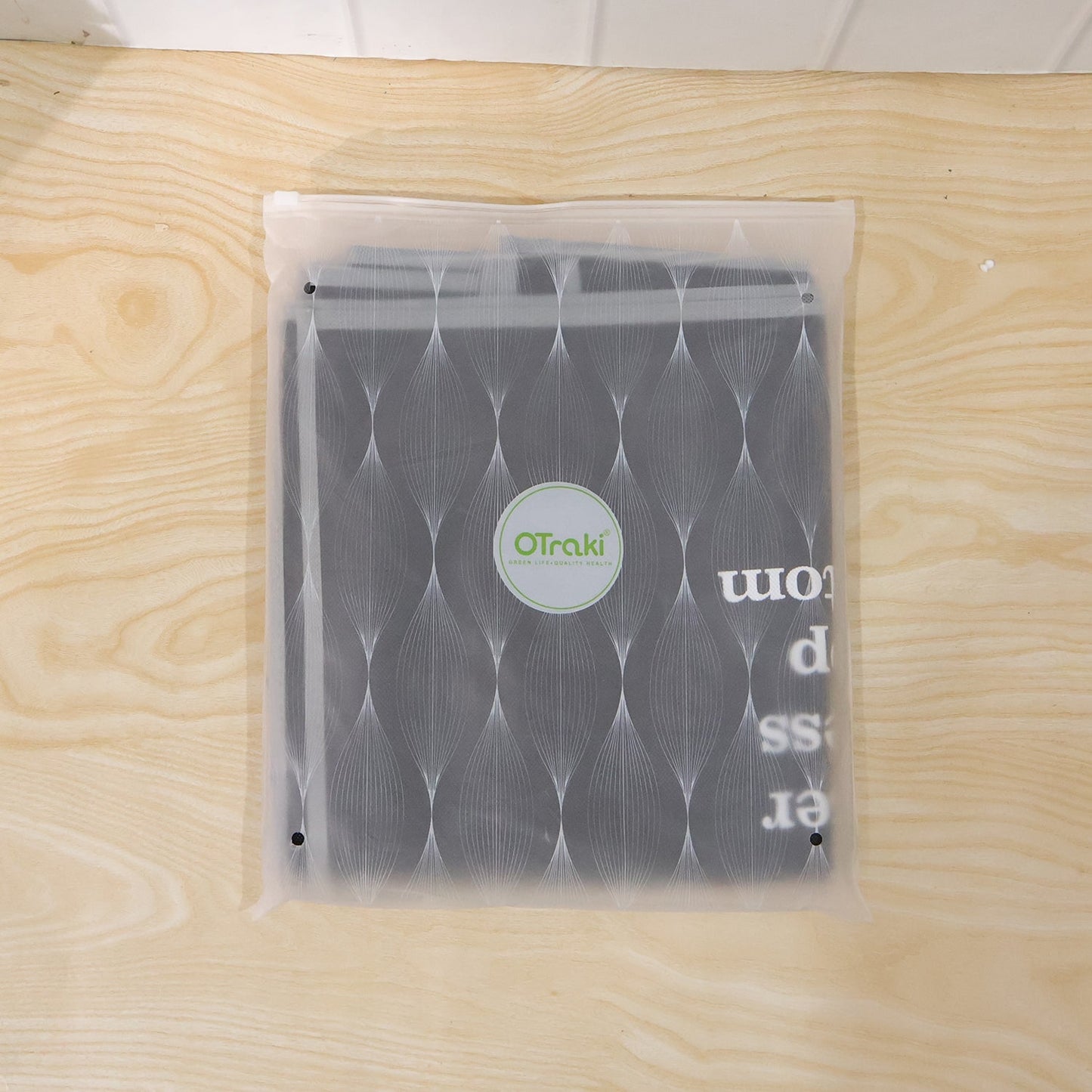 Clothes protected under dust cover in a wardrobe or shop rack