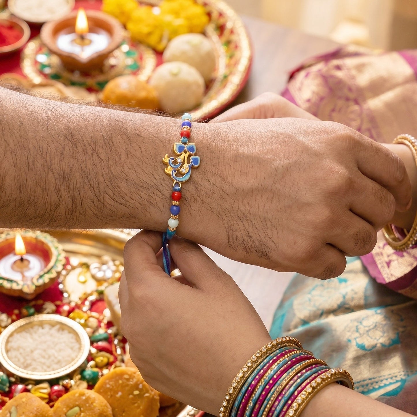 Close-up of Twin Peacock Golden Enamel Rakhi beads and intricate centerpiece