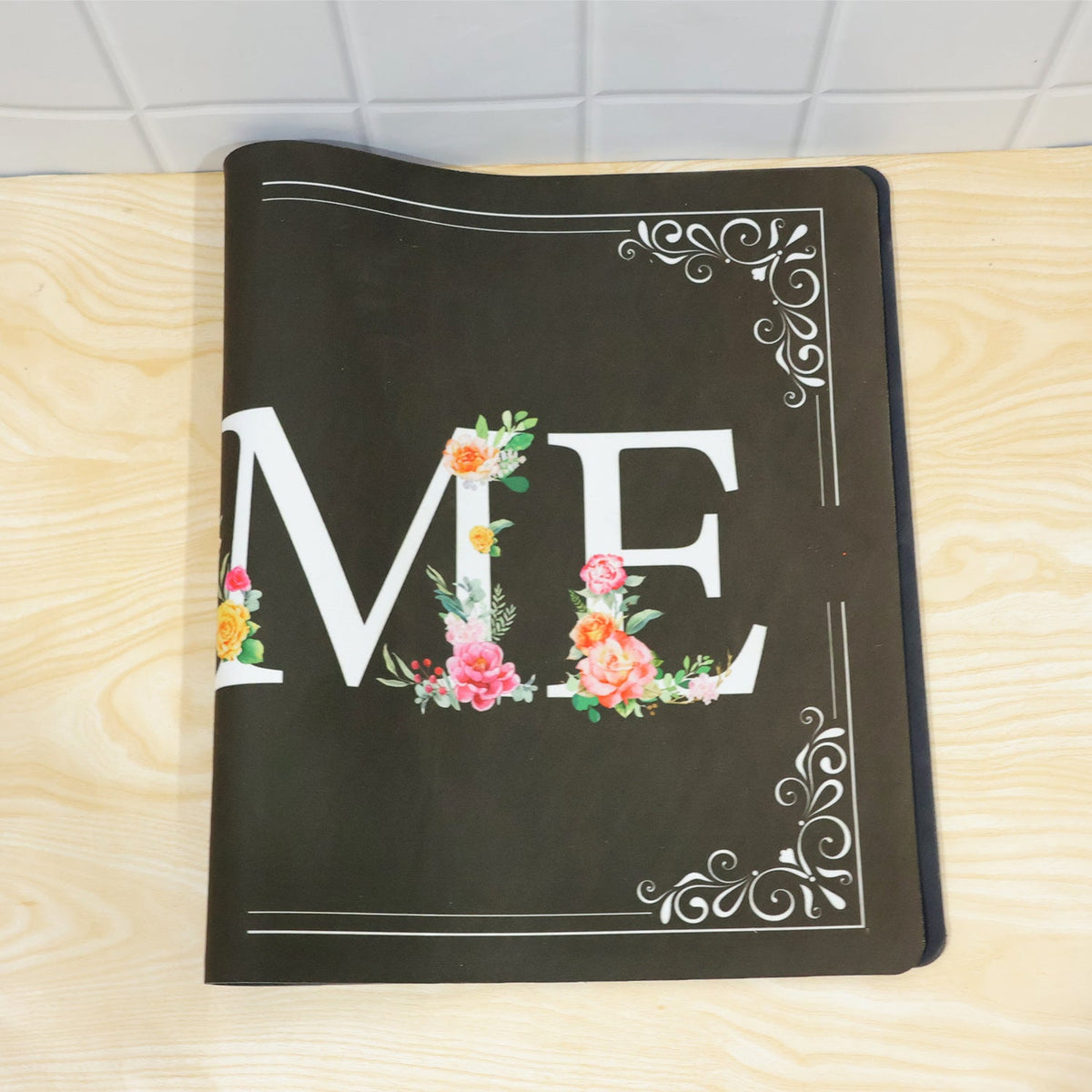 Floral print non-slip entrance mat rolled for storage