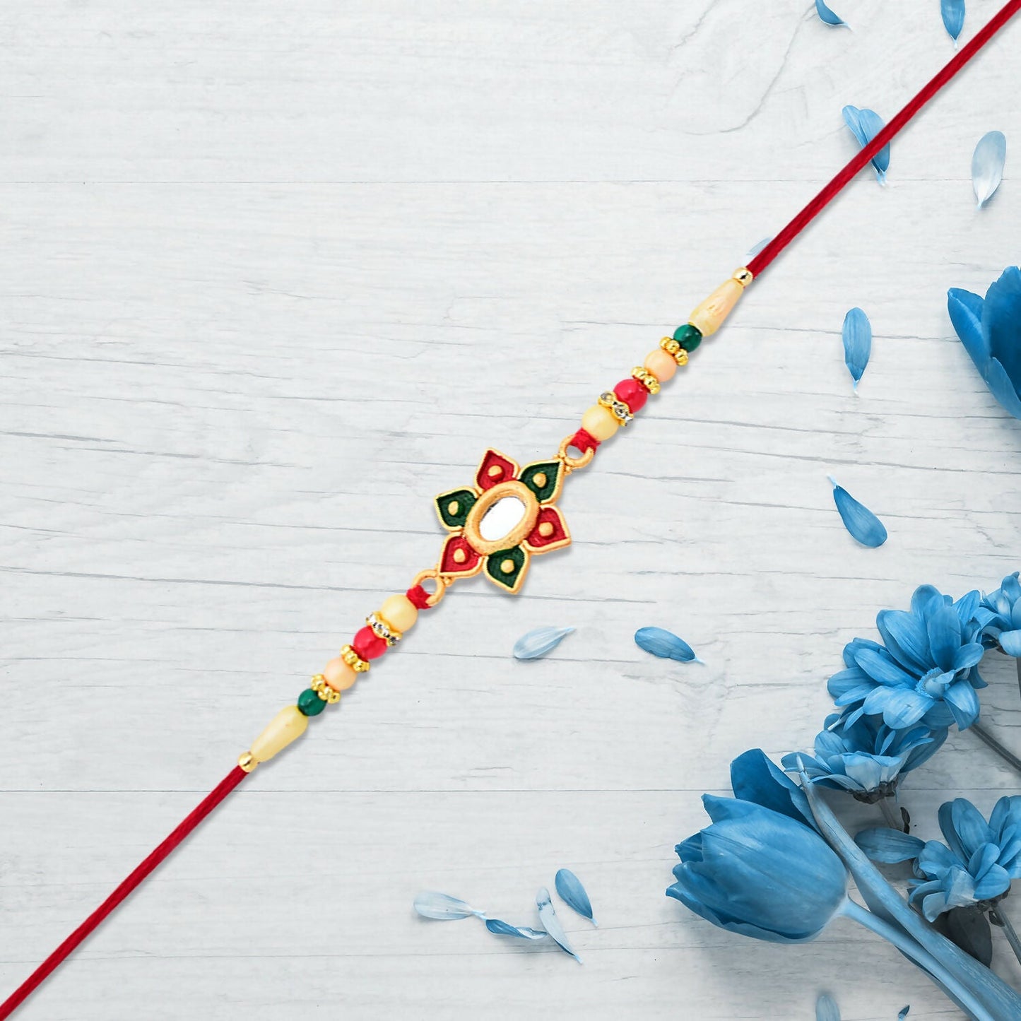 Handcrafted floral Rakhi with vivid multicolor stone detailing and comfortable thread