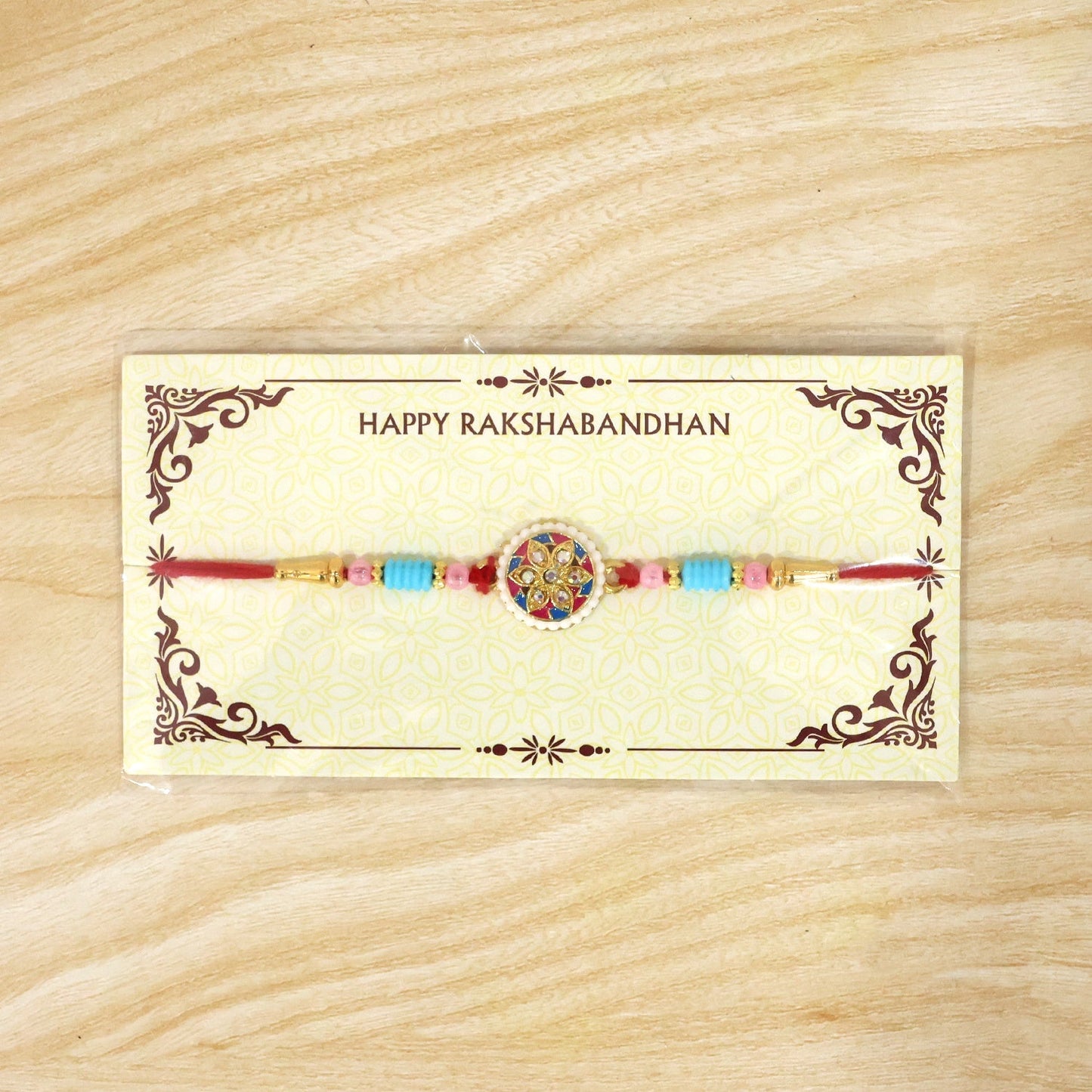 Festive multicolor floral kundan rakhi on white background