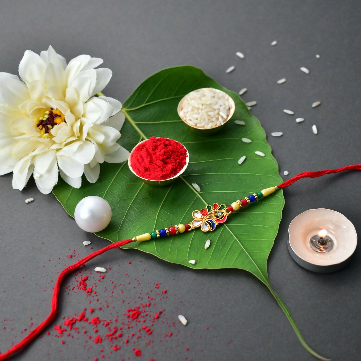 Traditional Peacock Feather Rakhi with detailed beadwork ideal for Raksha Bandhan.