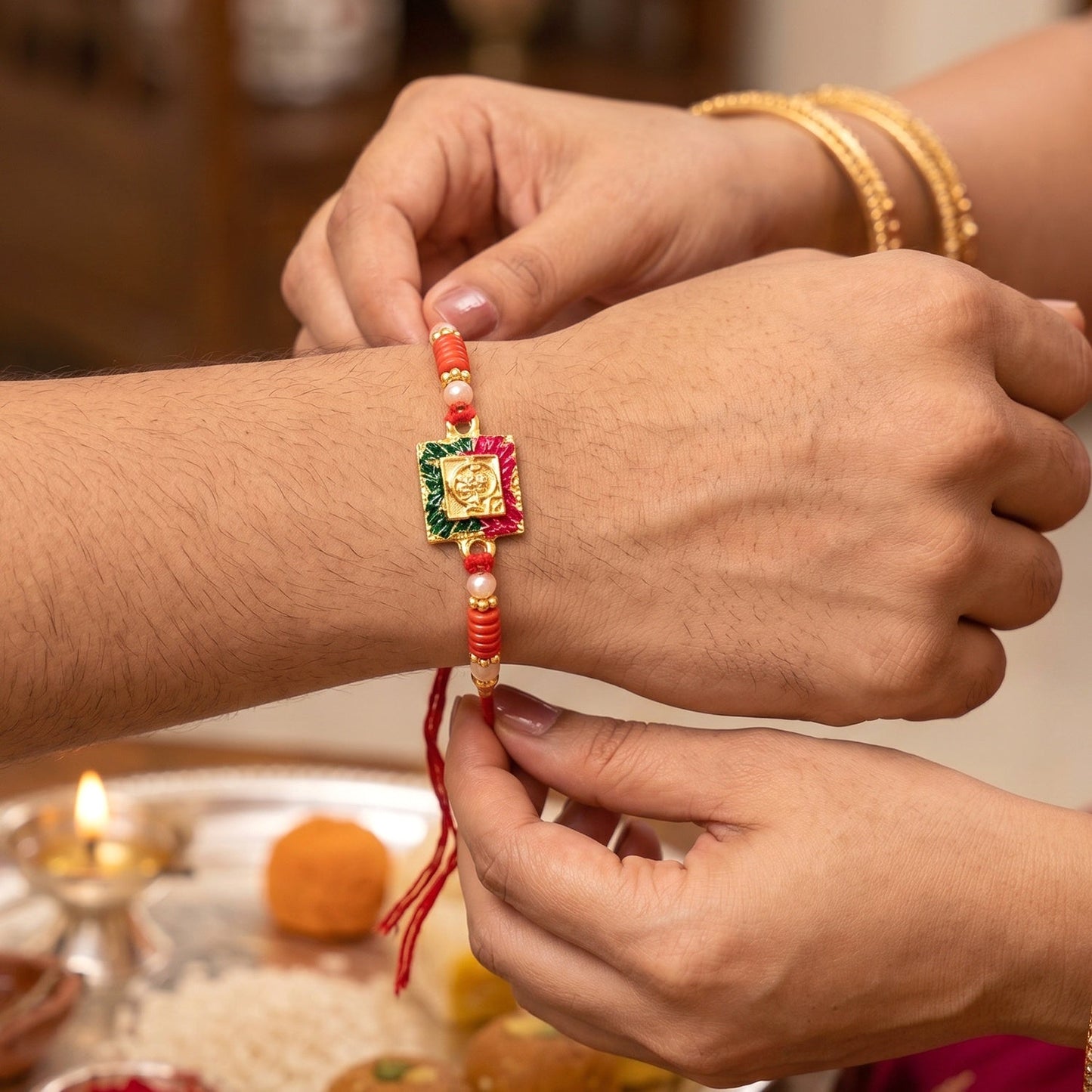 Traditional decorative rakhi with colorful beads and Ganesha motif