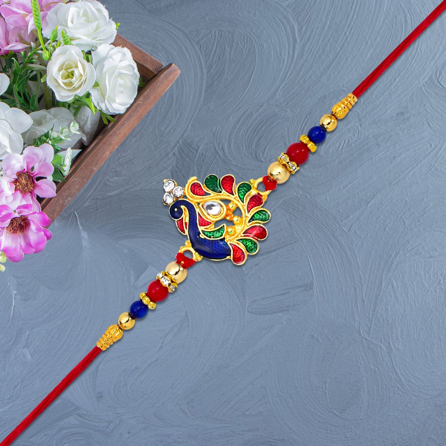 Traditional peacock Rakhi with vibrant colors and intricate details