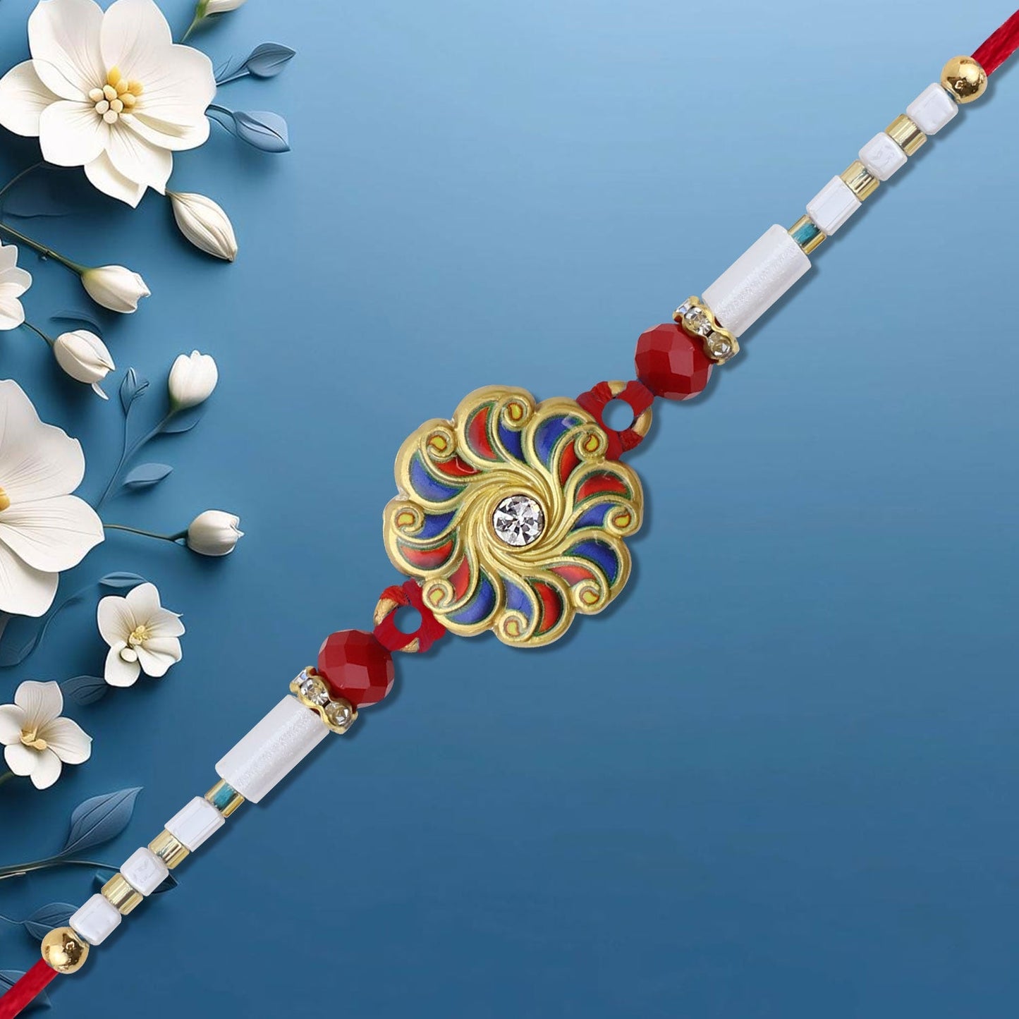 Handcrafted Blue Red Swirl Rakhi displayed on traditional fabric background