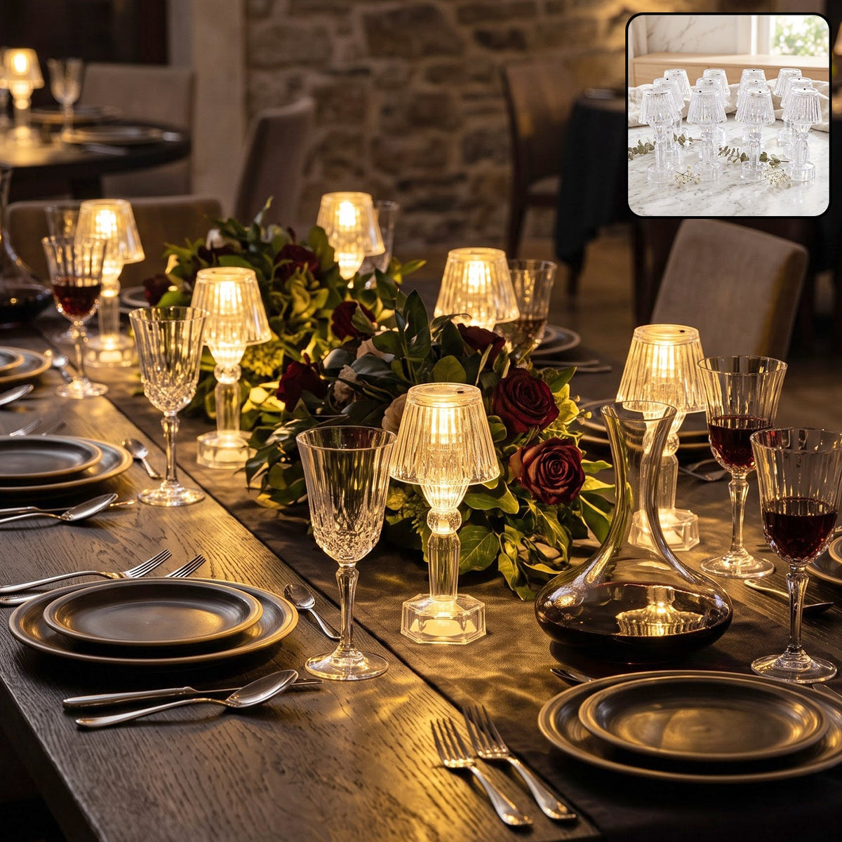Several clear acrylic LED table lamps illuminating a formal dining table set with wine glasses and plates.