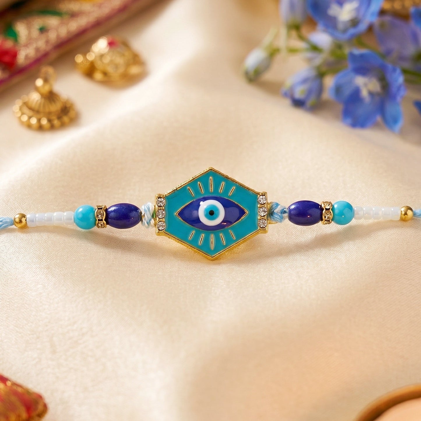 Close-up of turquoise evil eye hexagon Rakhi centerpiece