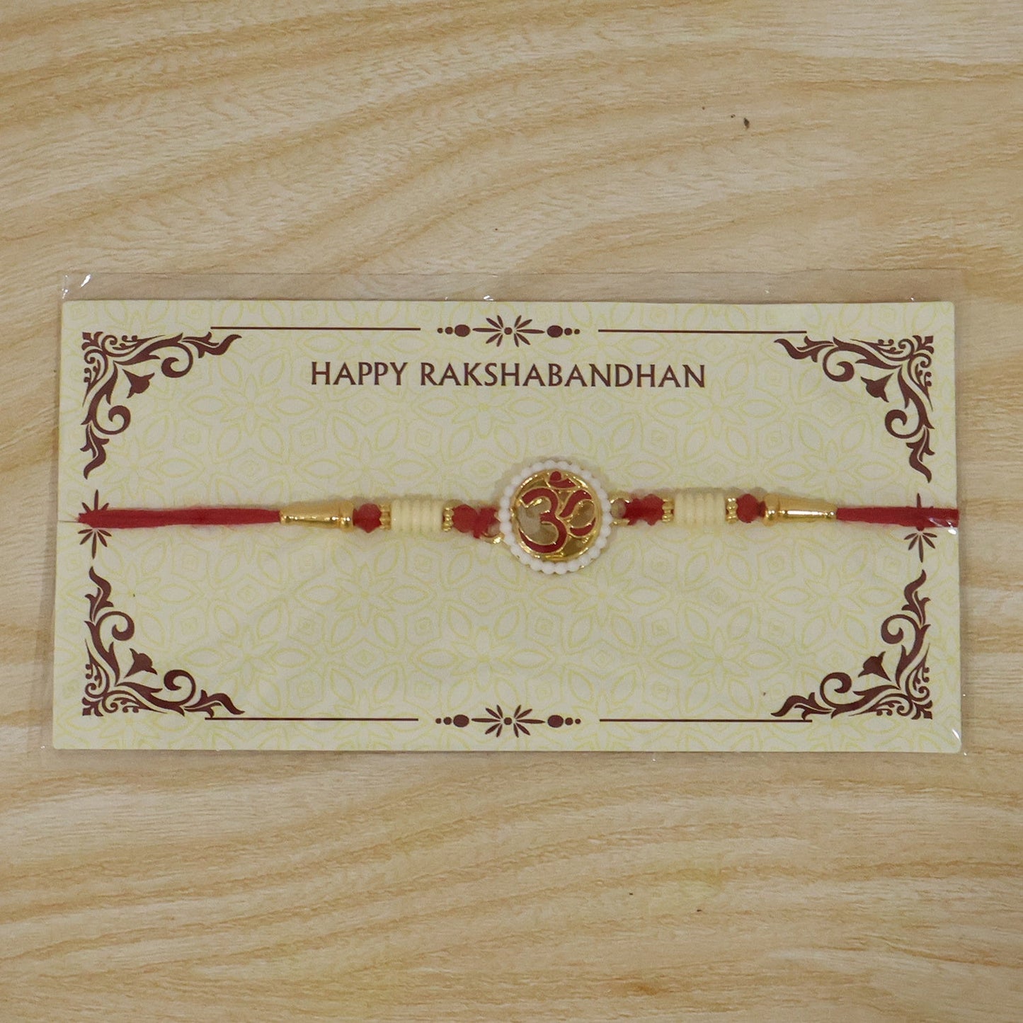 Festive Rakhi with OM symbol and lightweight thread