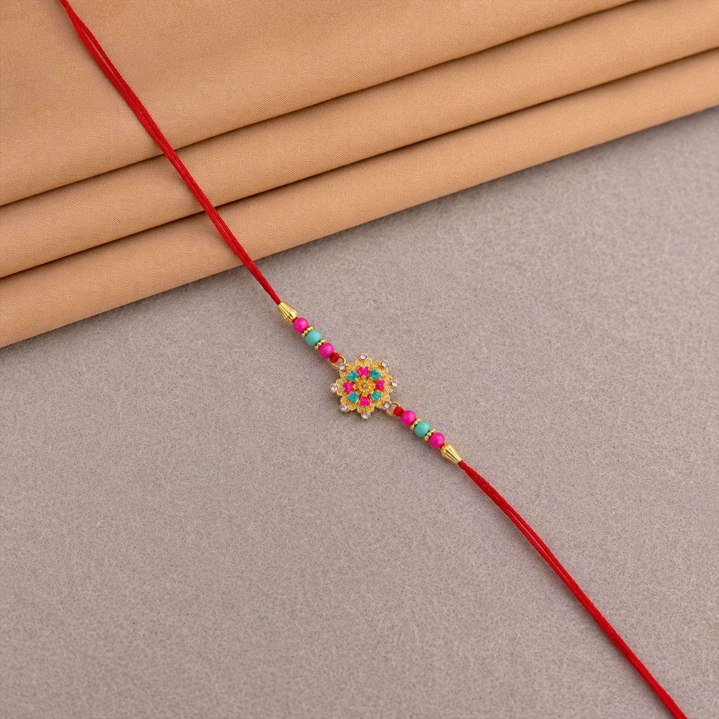 Pink floral mandala Rakhi thread and centerpiece detail