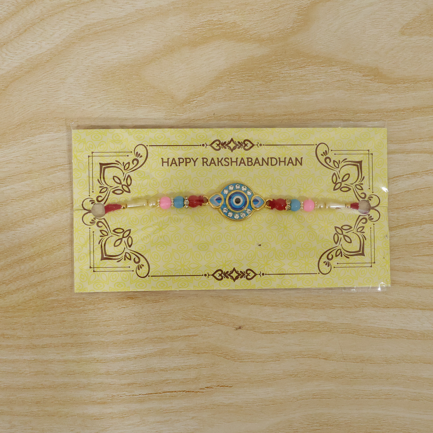 Evil Eye Rakhi tied on wrist, ready for celebration.