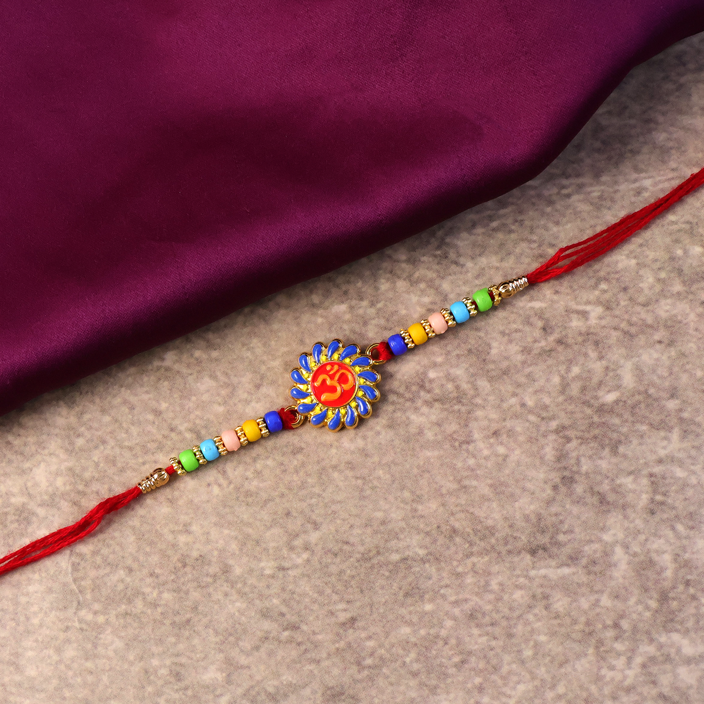 Colorful beads on OM symbol Rakhi
