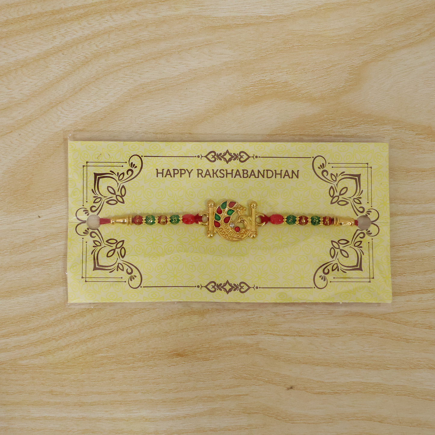 Lifestyle image of Rakhi worn on wrist, demonstrating festive appeal.