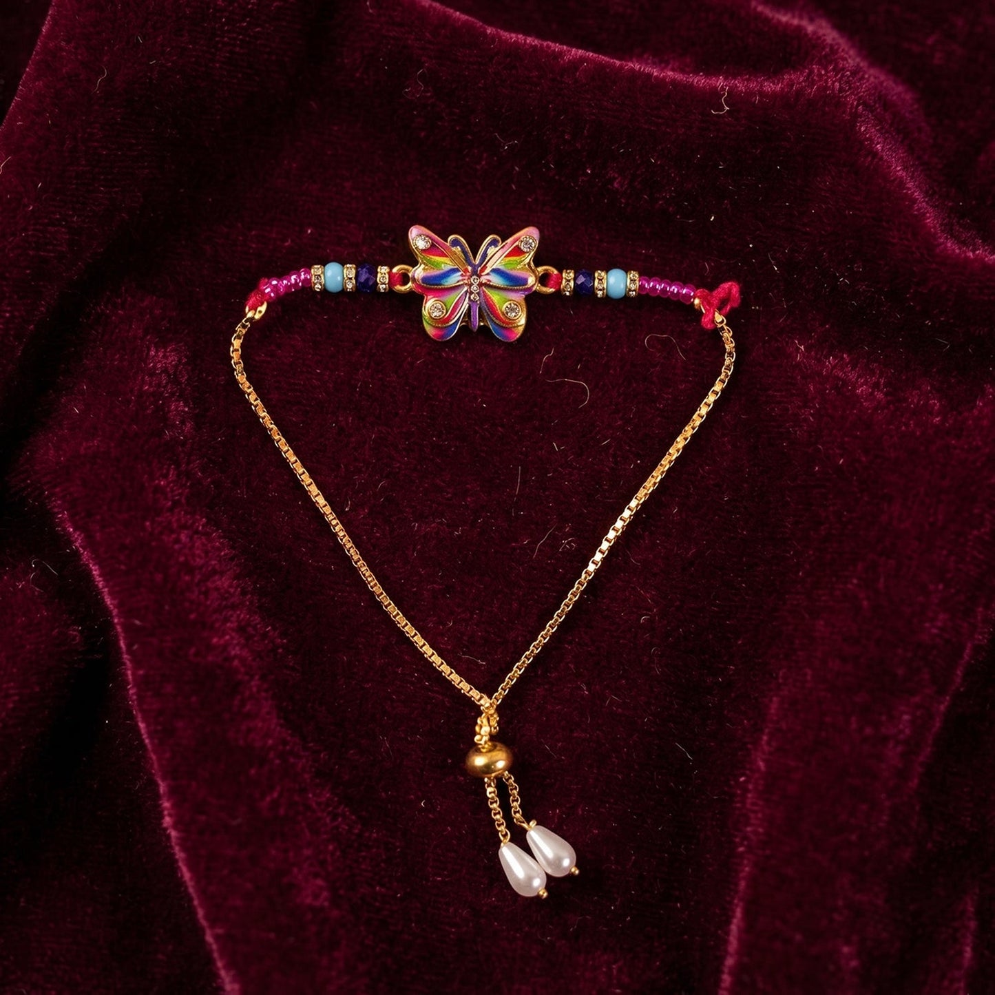 Top view of Rainbow Butterfly Rakhi with beads and thread
