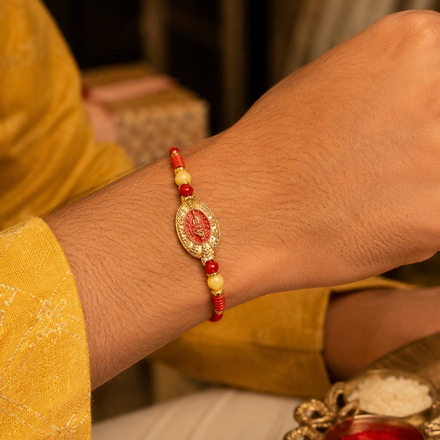 Close-up of designer Rakhi with stylish centerpiece and bead details