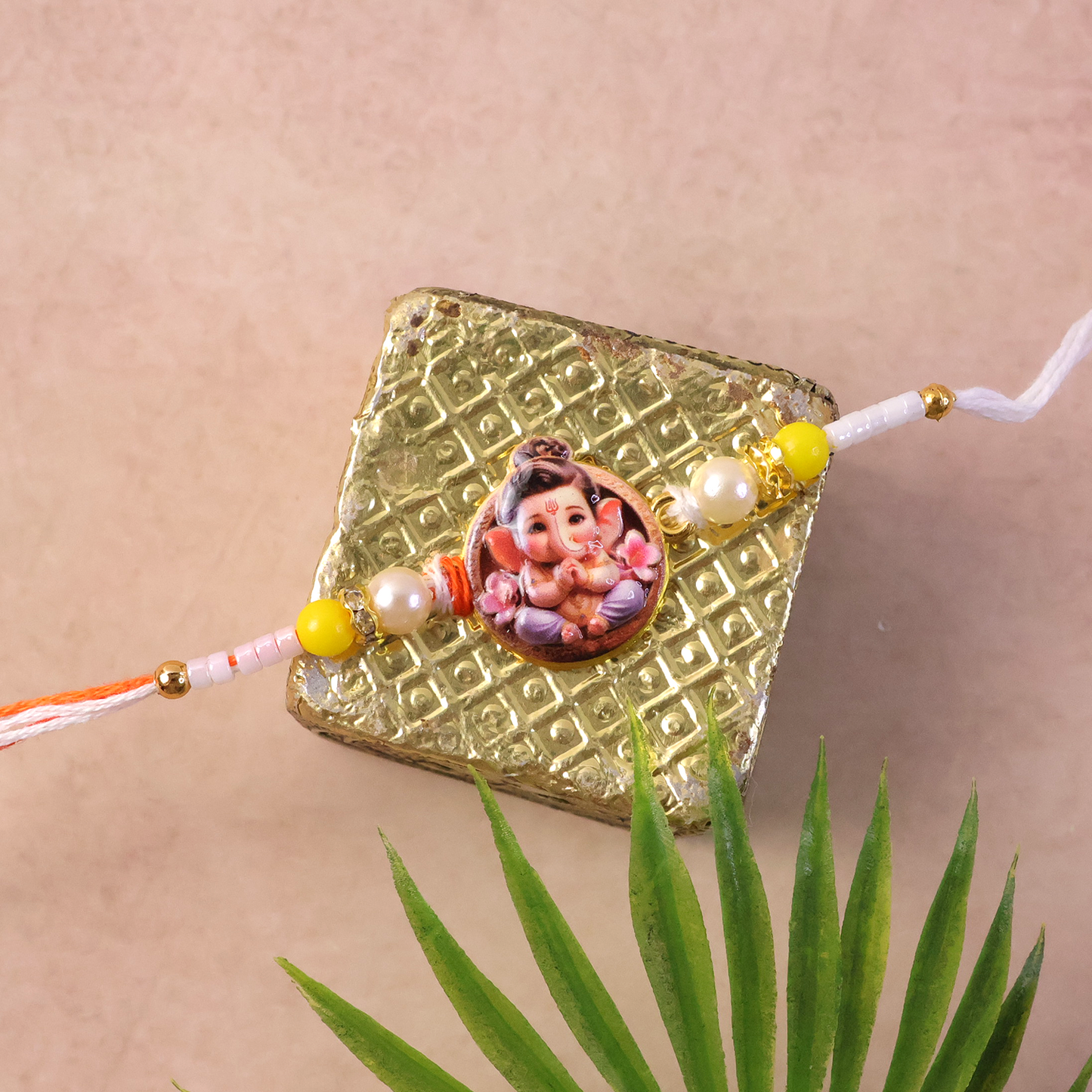 Top view of Ganesh Ji Premium Rakhi with colorful beads