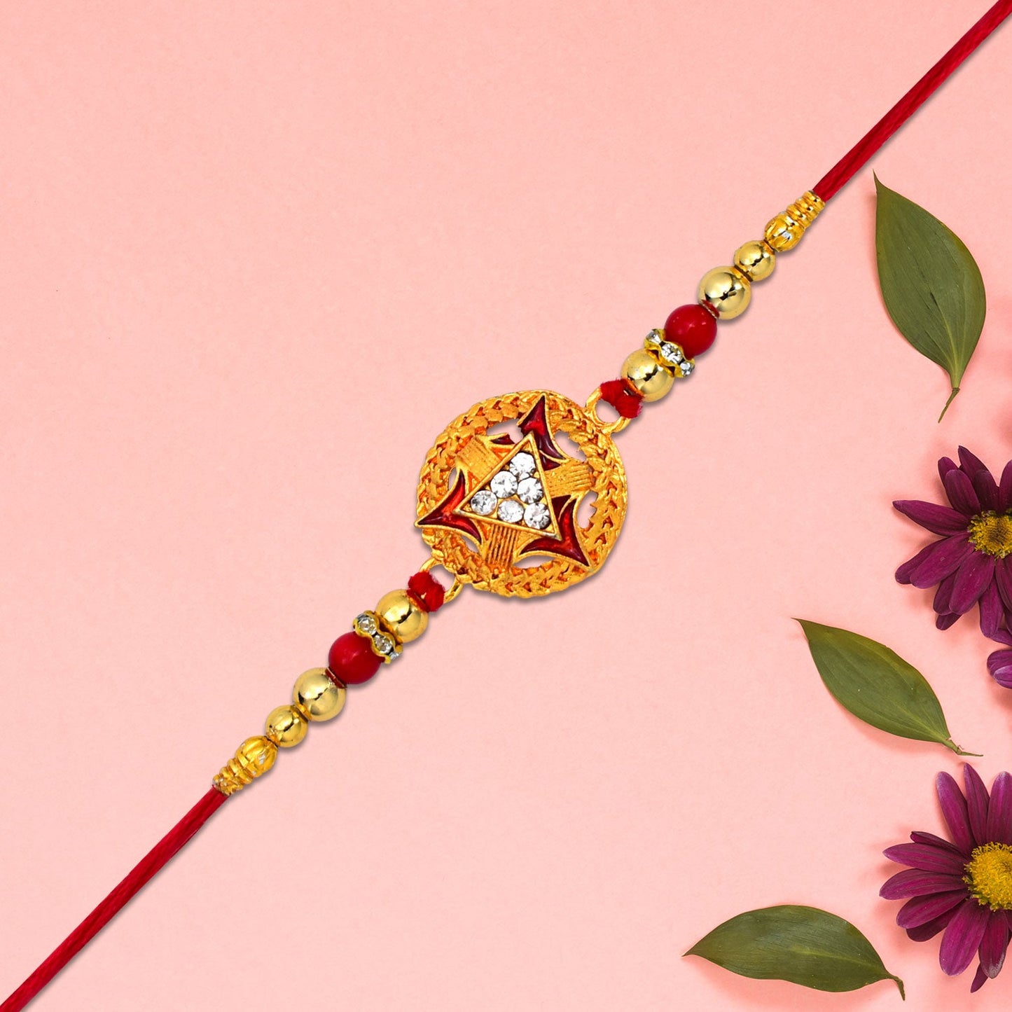 Gold-plated round Rakhi with traditional design for Rakshabandhan